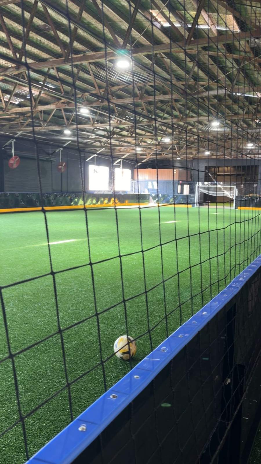 The indoor field at RR Indoor Complex seen through the goal net