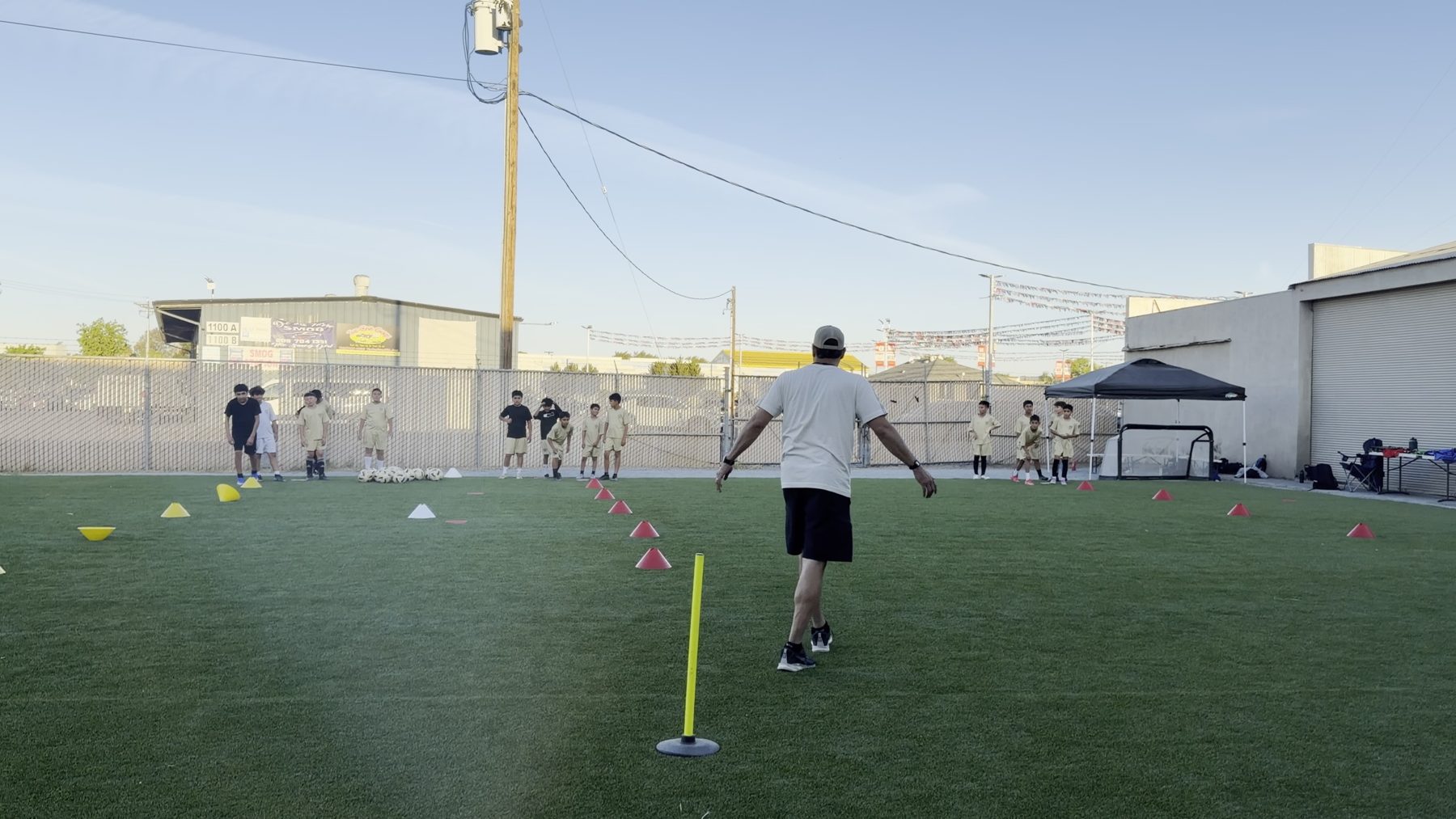 An RR coach running a training drill with young players