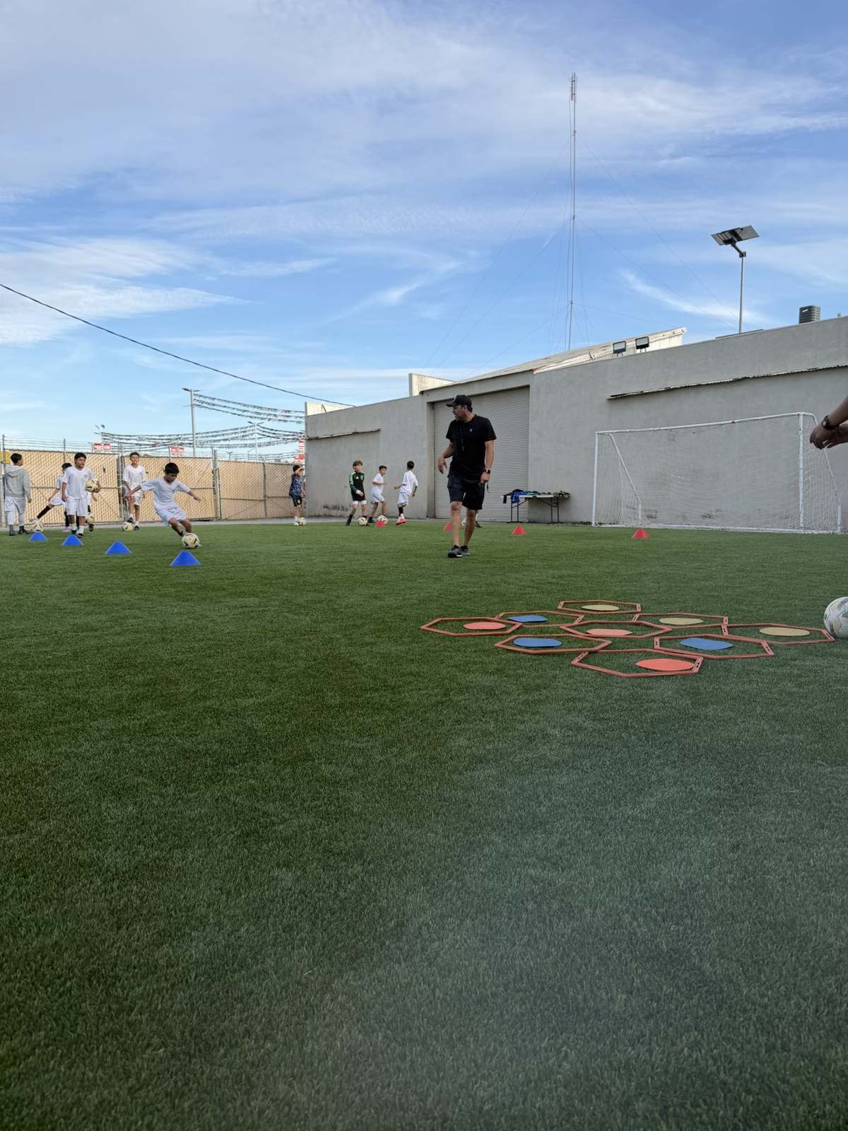 Players working through a cone drill at an RR training session